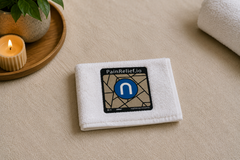 PainReleif.io Neurocuple® device on a clean white towel